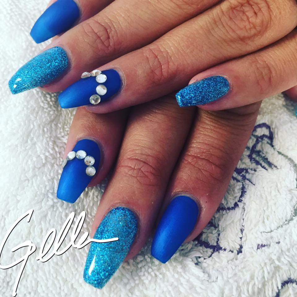 Brilliant blue matte and glitter nails with crystal accents