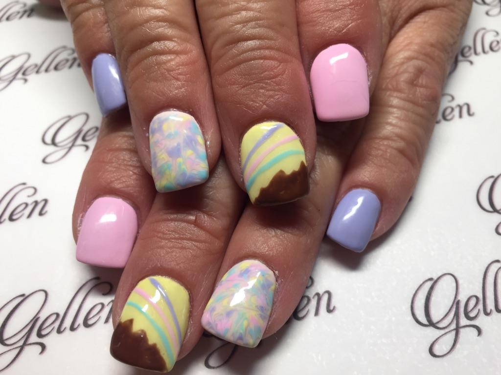 Pastel Easter nail art with decorated egg designs