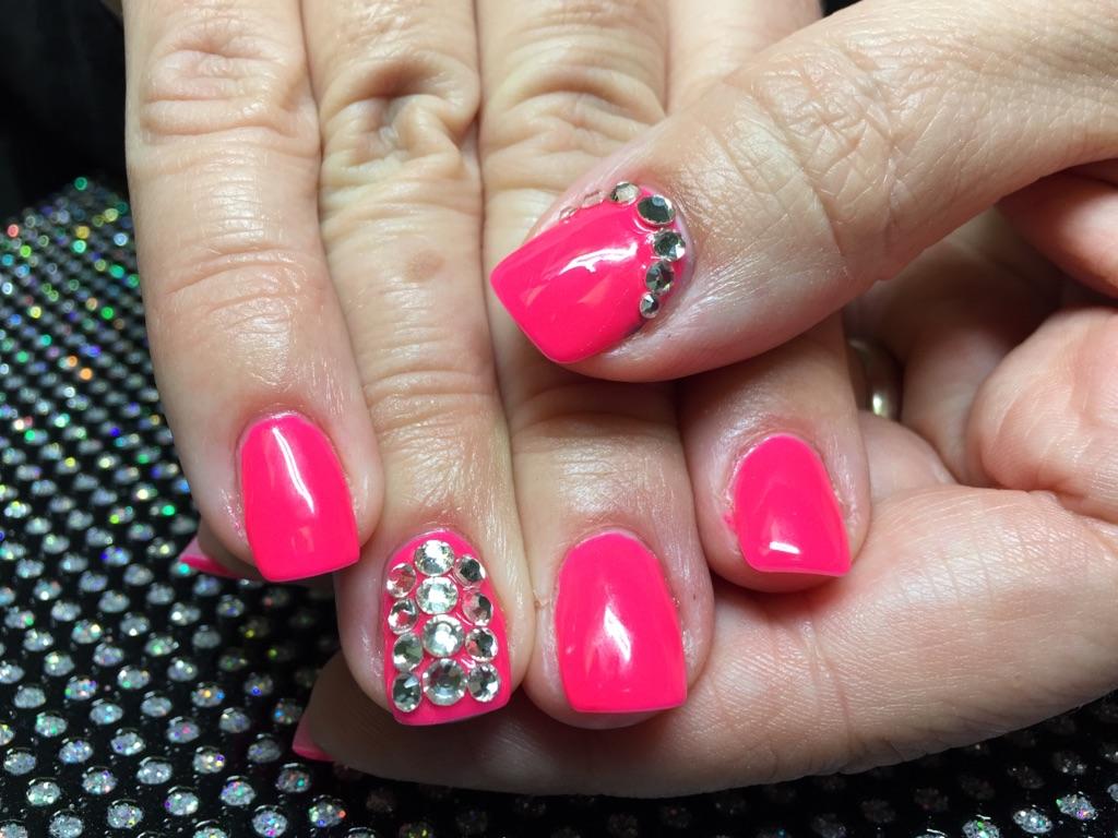 Hot pink nails with full crystal accent nail
