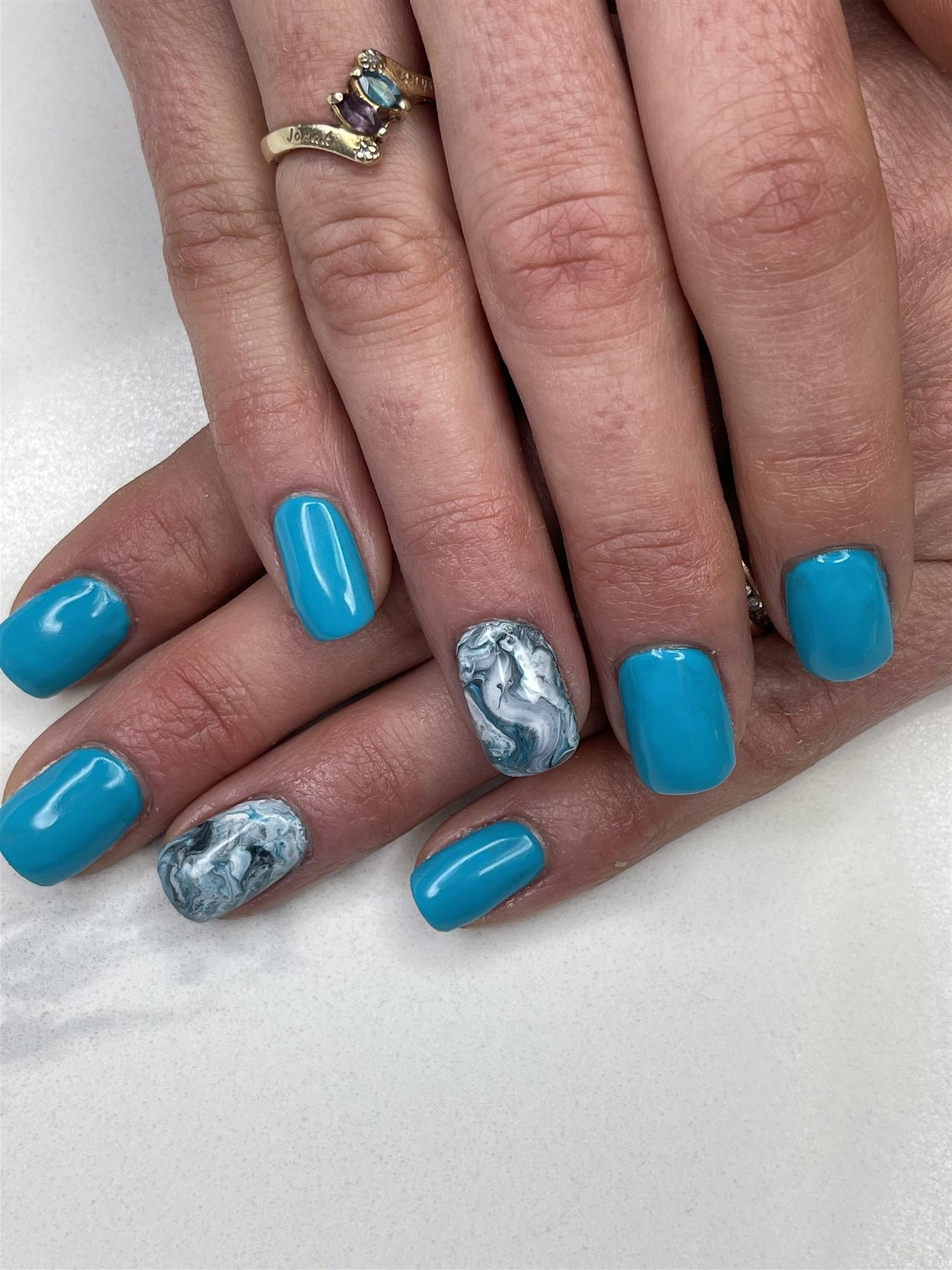 Turquoise nails with white and grey marble accents