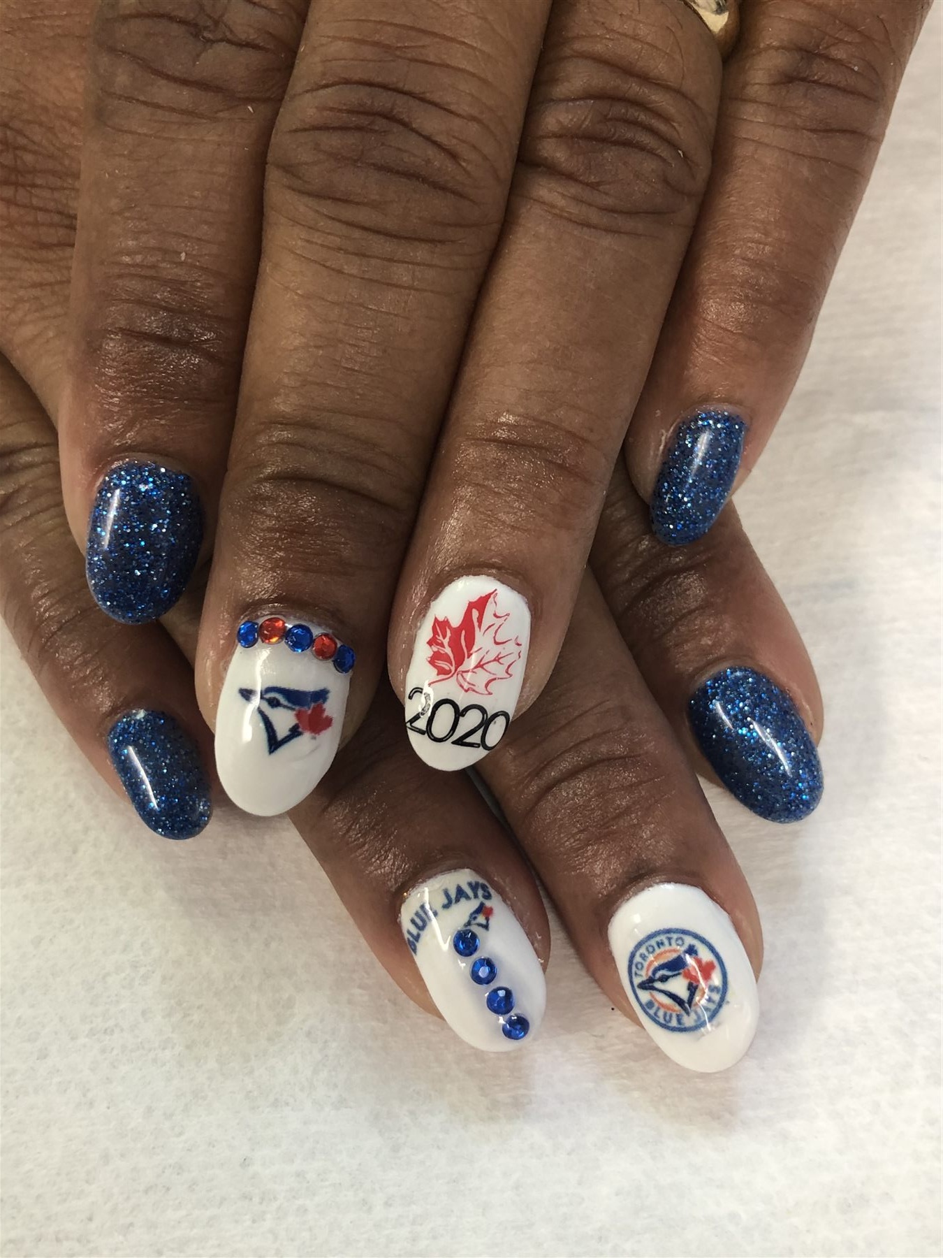 Toronto Blue Jays nail art in blue glitter white and red