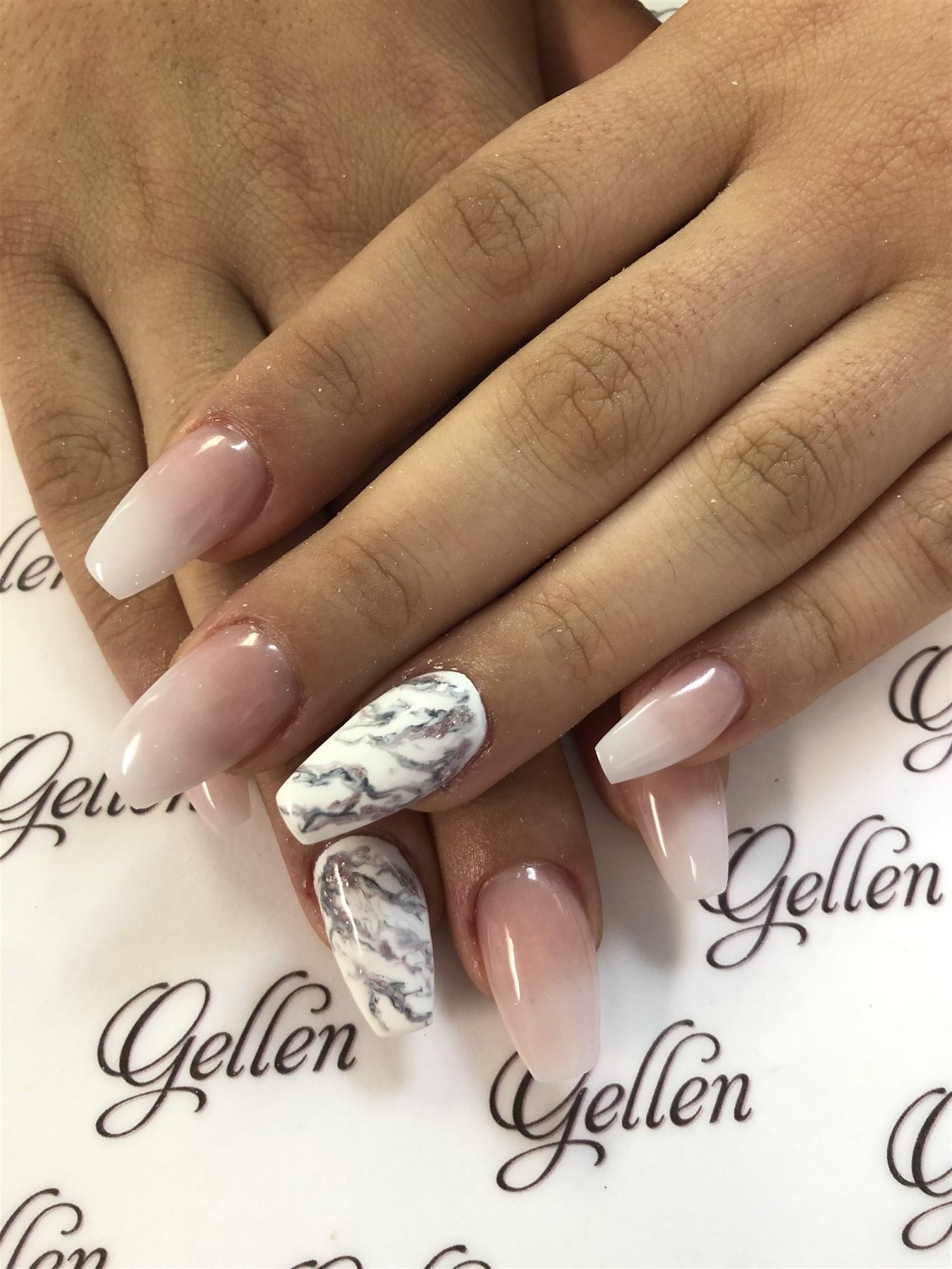 Blush ombre nails with white marble accent nails