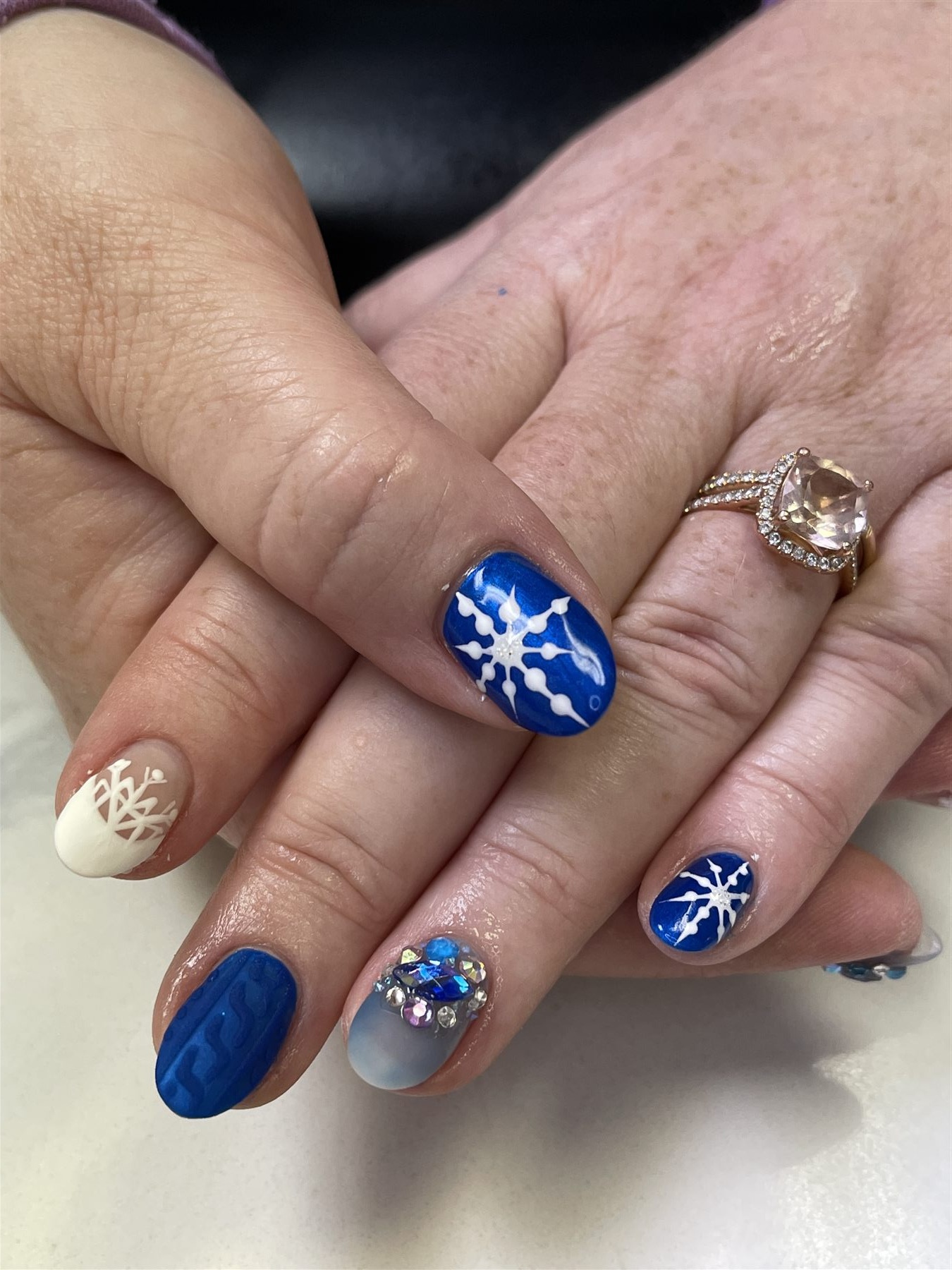 Royal blue winter nails with snowflakes knit texture and crystal accent
