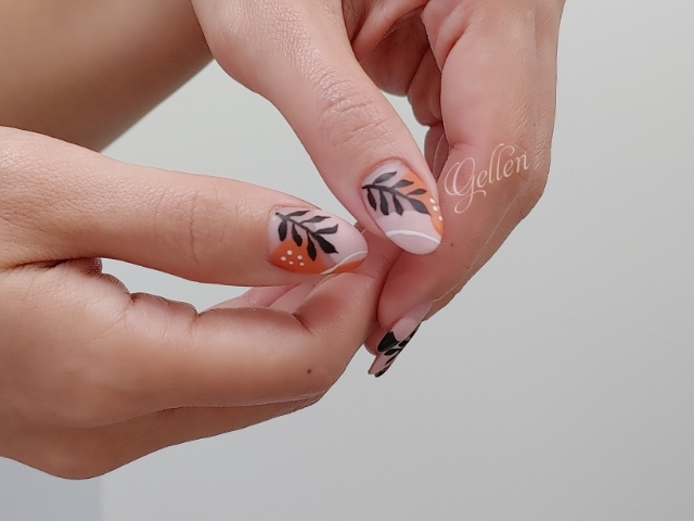 Terracotta blush and black botanical nail art