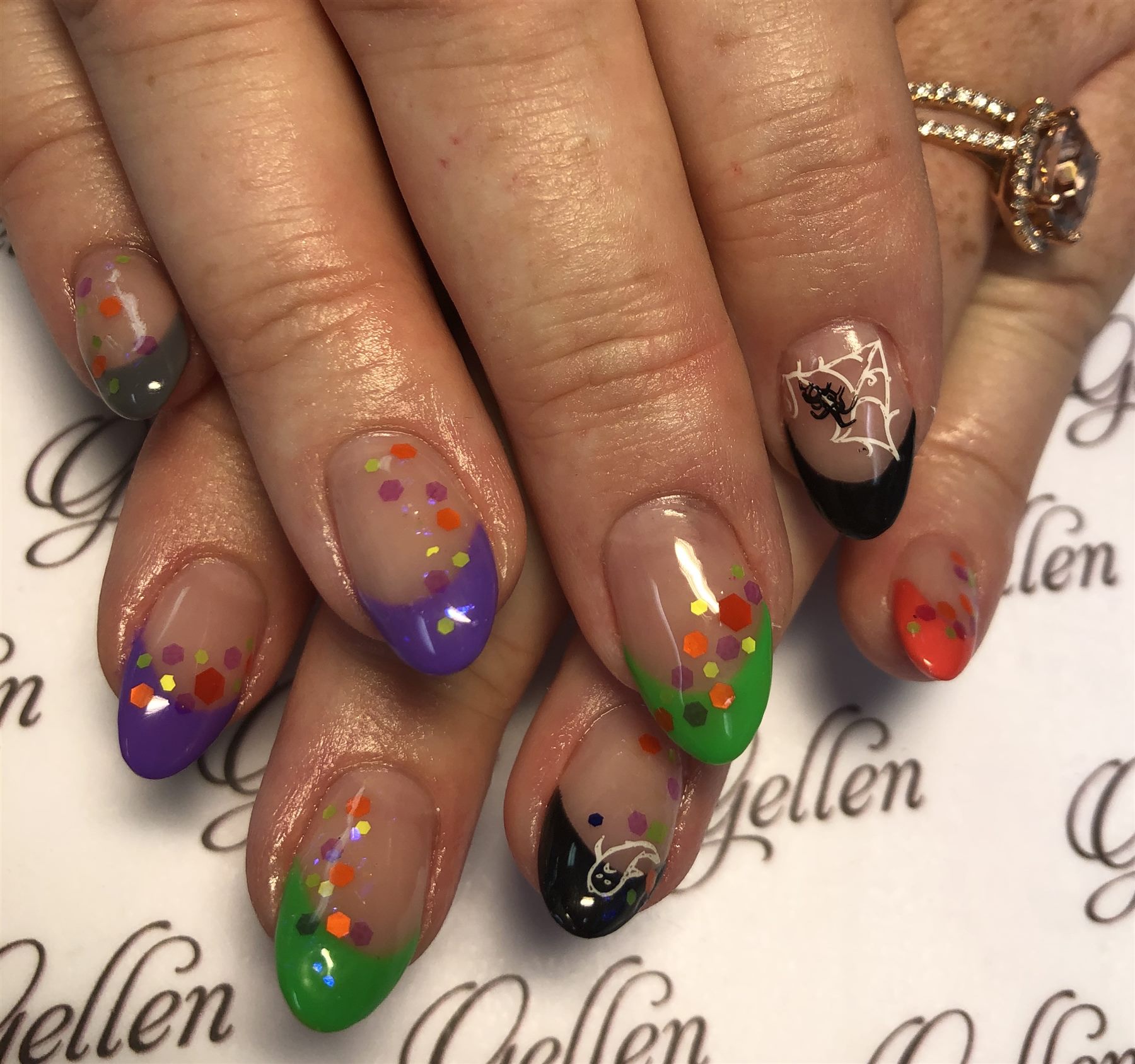 Colorful Halloween French nails with confetti spider web and cat art