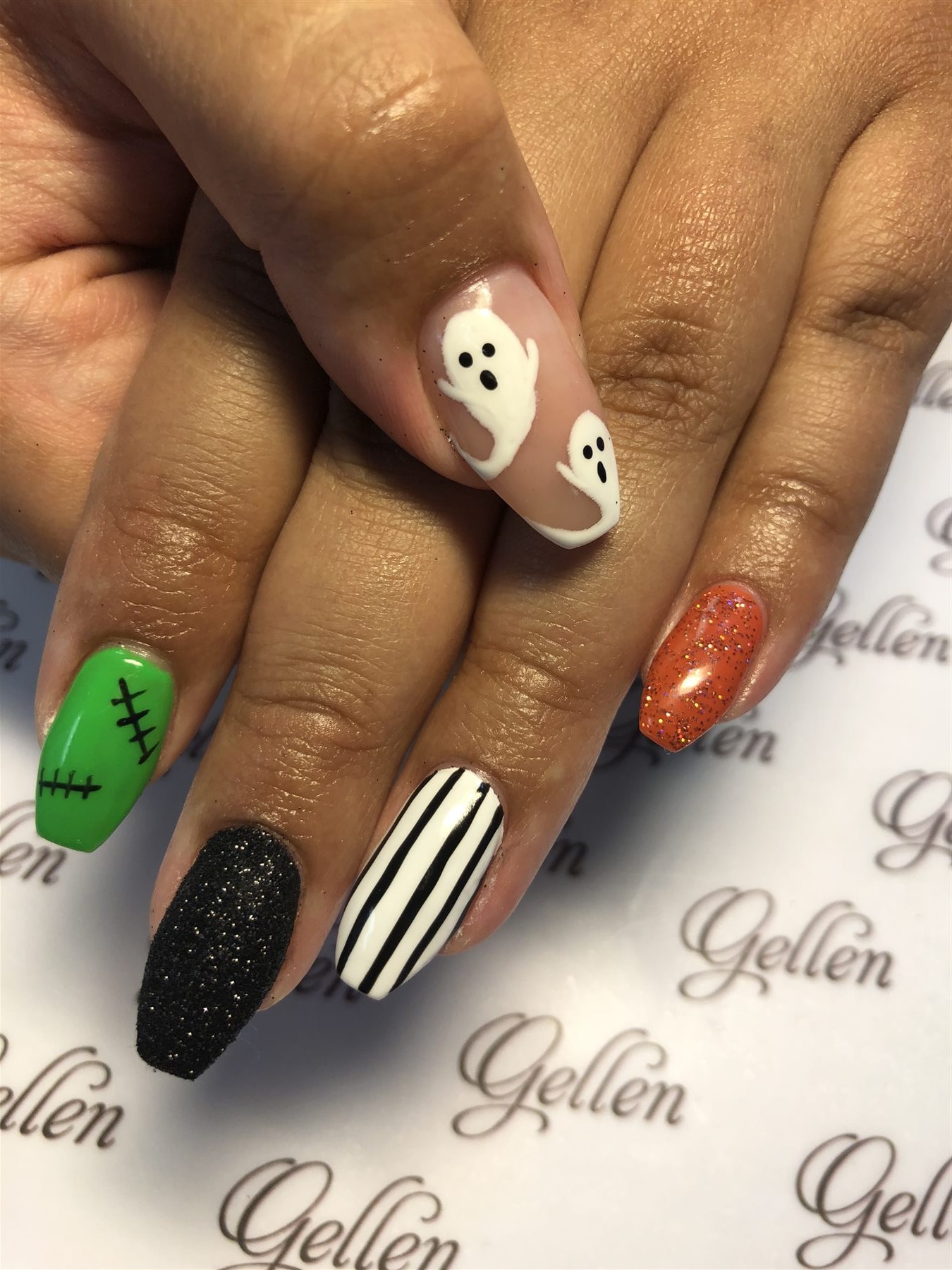 Halloween nails with ghosts stripes glitter and stitched green art