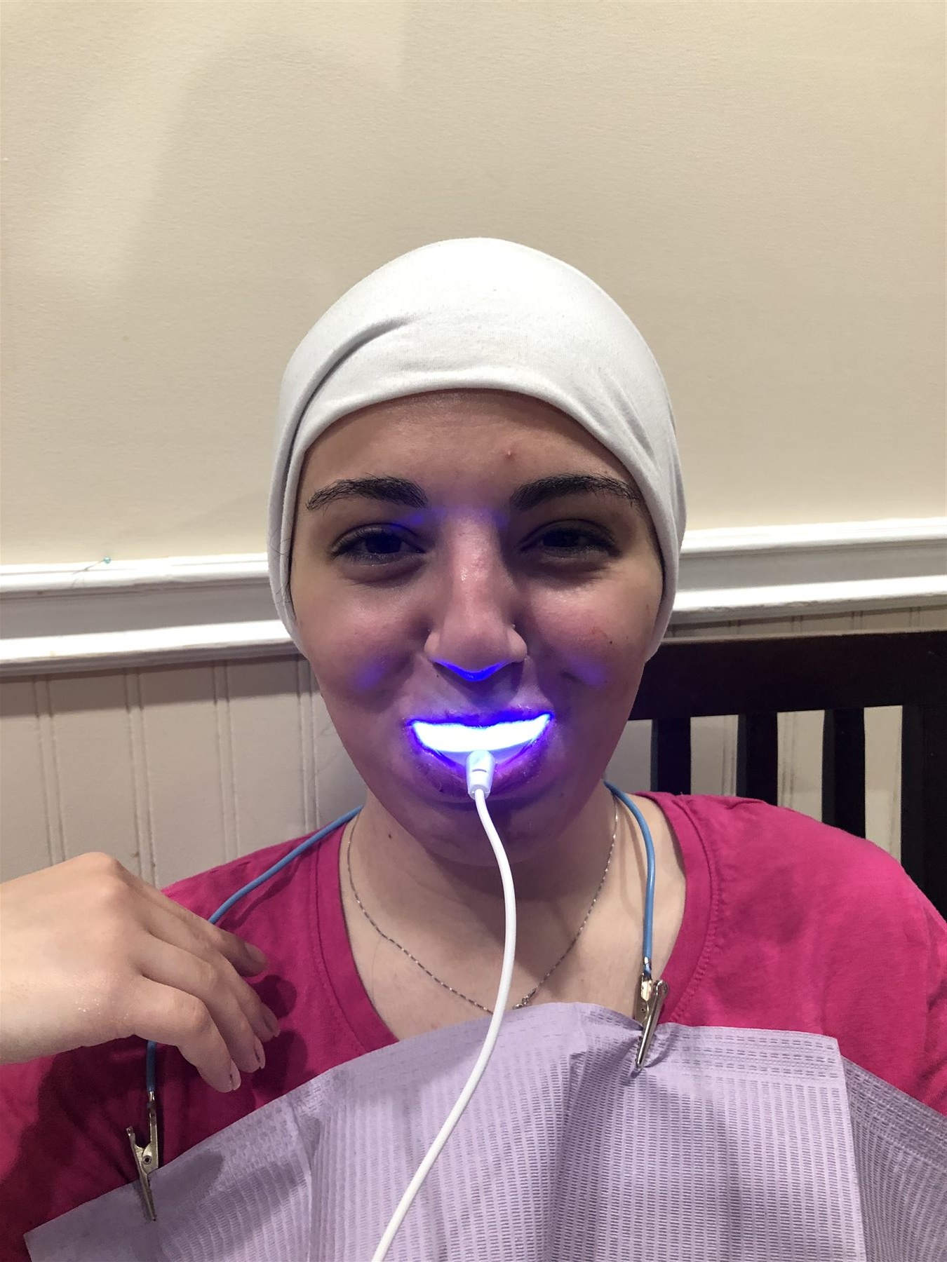 Client receiving a Gellen Pearl LED teeth whitening treatment